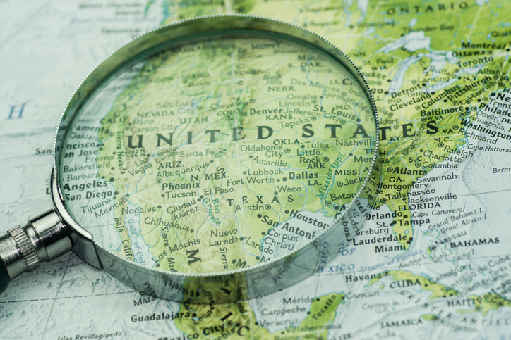 A magnifier glass over USA map