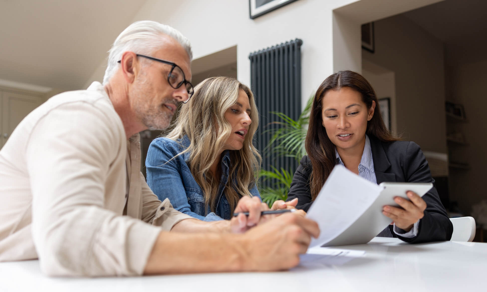 Property buyers meeting with a real estate advisor
